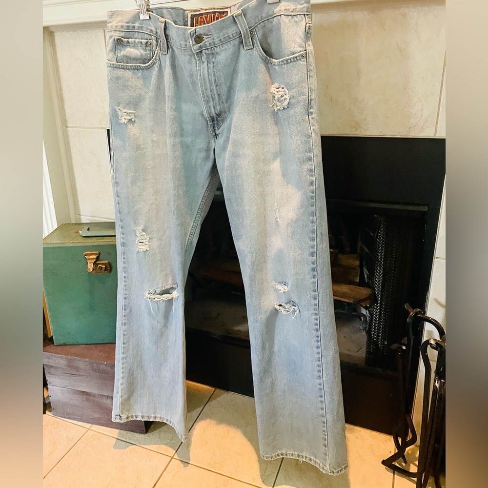 Vintage Levi jeans low boot cut, well worn. Size 36.